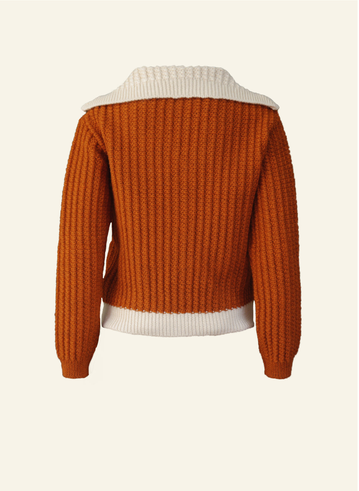 A Corvette rust orange cardigan with a hood and pockets, made from 100% British wool, displayed against a neutral background. Back profile.