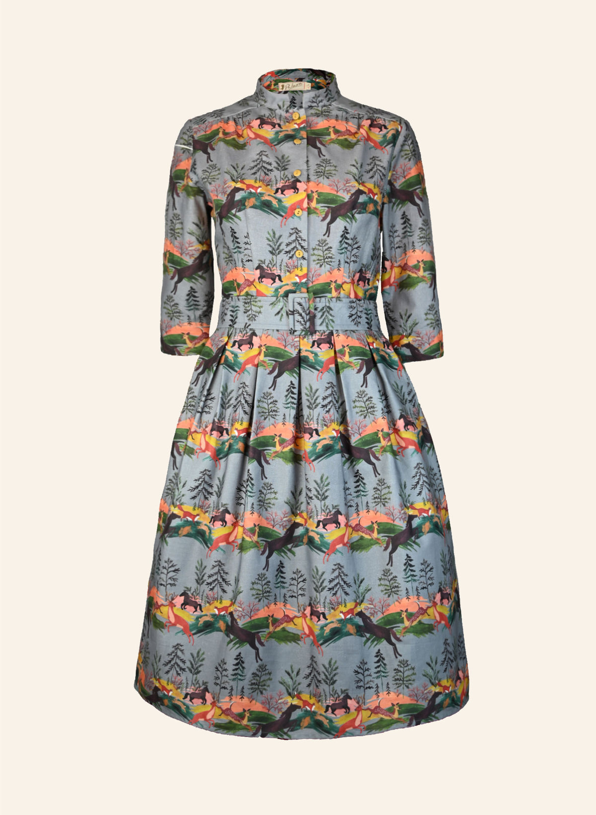 Autumnal vintage-style dress with nature-themed deer print on a plain eggshell background