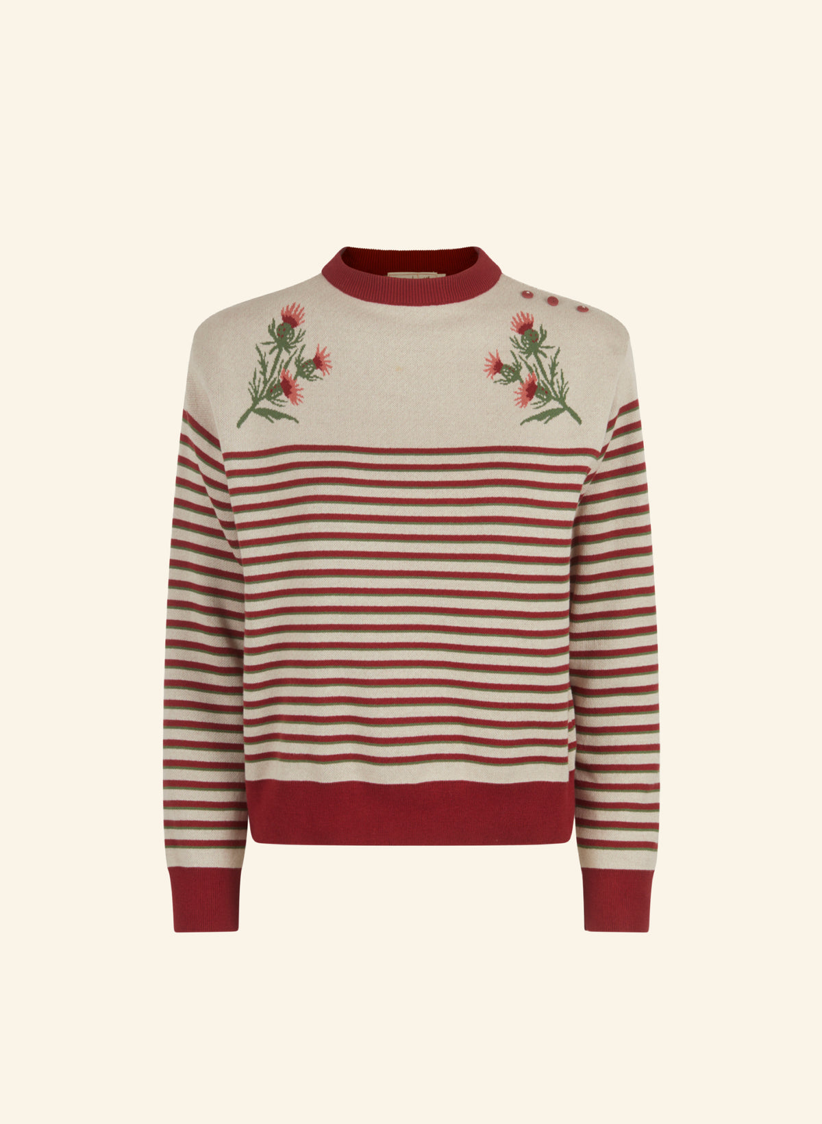 A cream and rust red striped knit sweater for women with embroidered thistle motifs on the chest, a solid rust red crew neck, and matching rust red ribbed cuffs and hem, shown against a solid cream background.