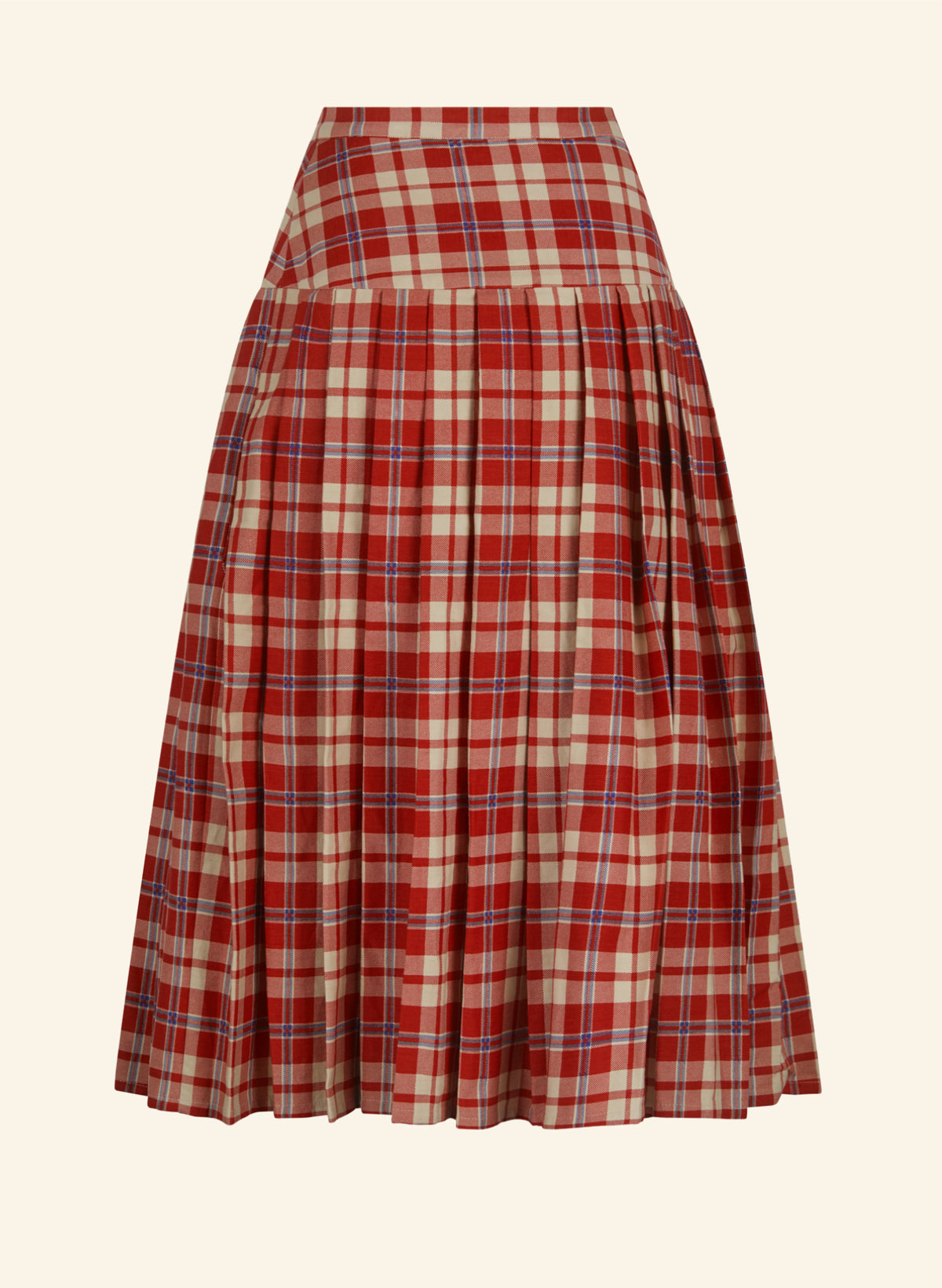 A pleated A-line kilt skirt in a red, beige, and blue plaid pattern, shown against a solid cream background.