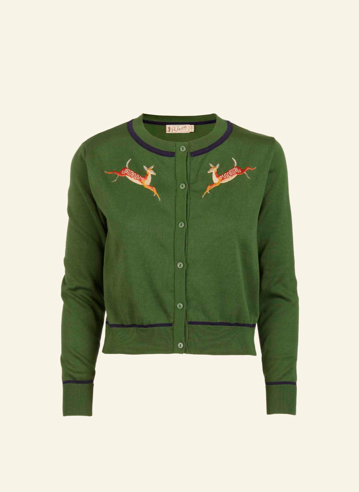 Green cardigan with embroidered deer designs on a beige background