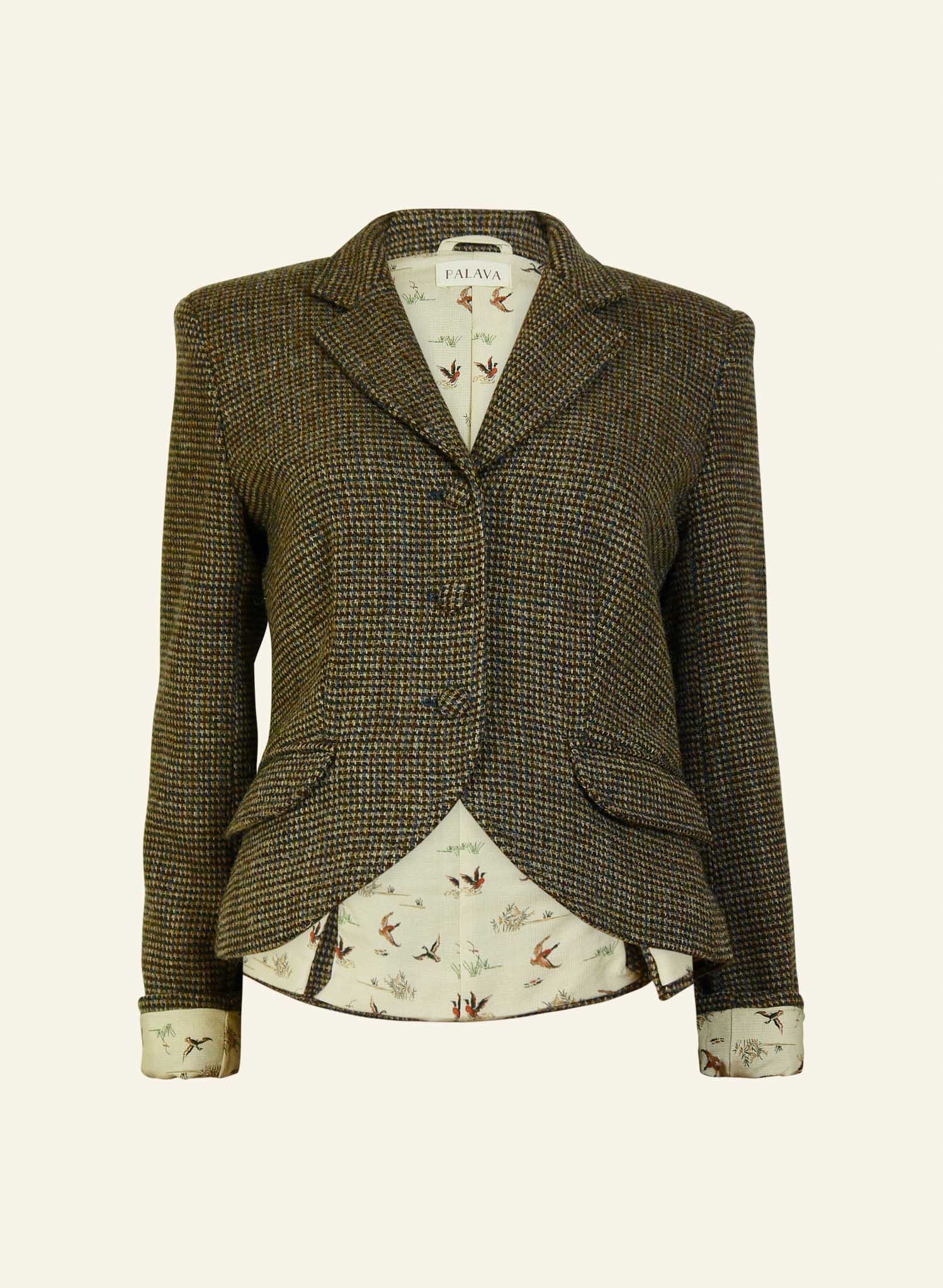 A hazel brown luxury harris tweed riding jacket with buttoned front and peak lapel, lined with a duck pattern, made from Harris Tweed.