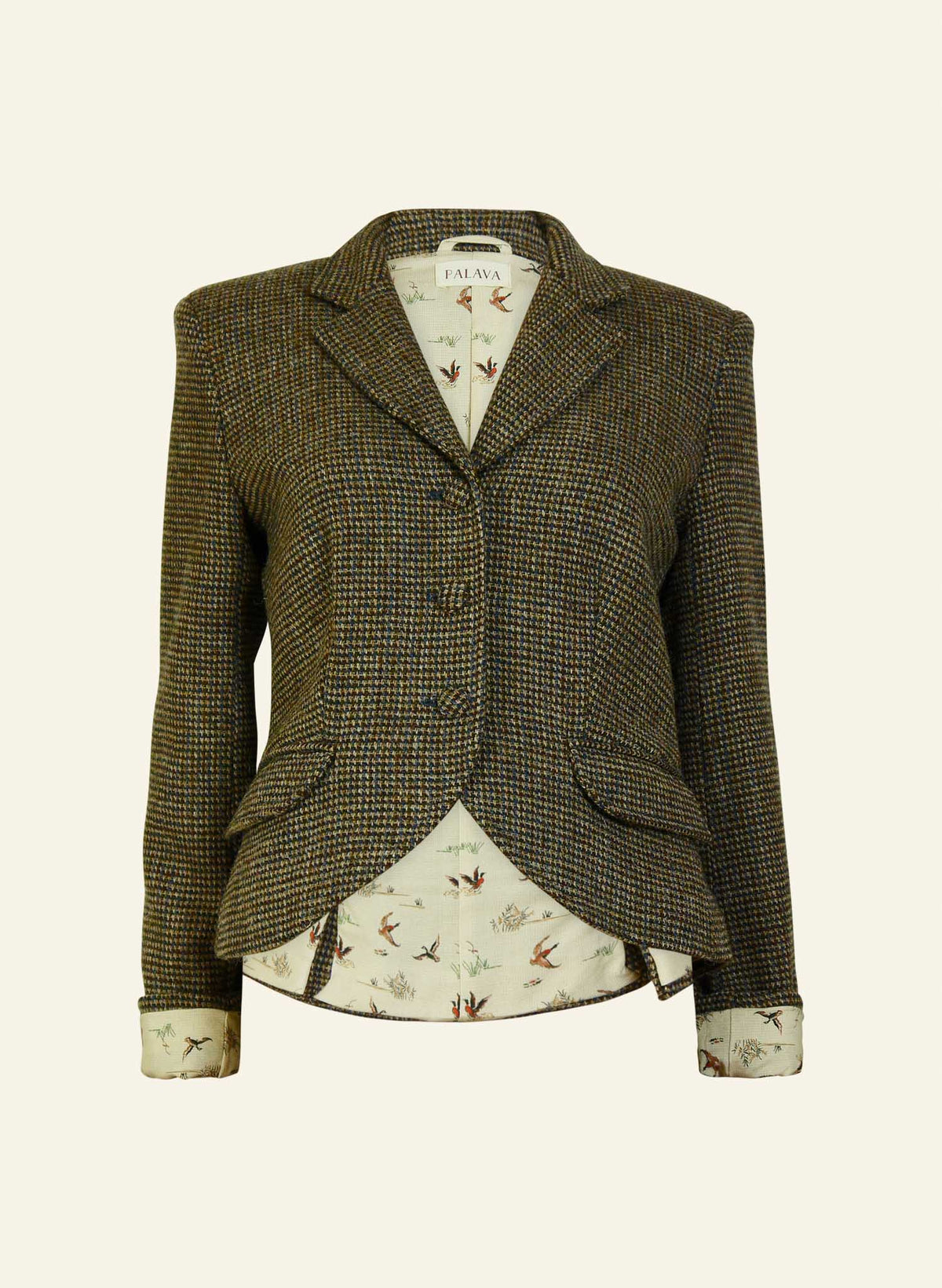 A hazel brown luxury harris tweed riding jacket with buttoned front and peak lapel, lined with a duck pattern, made from Harris Tweed.